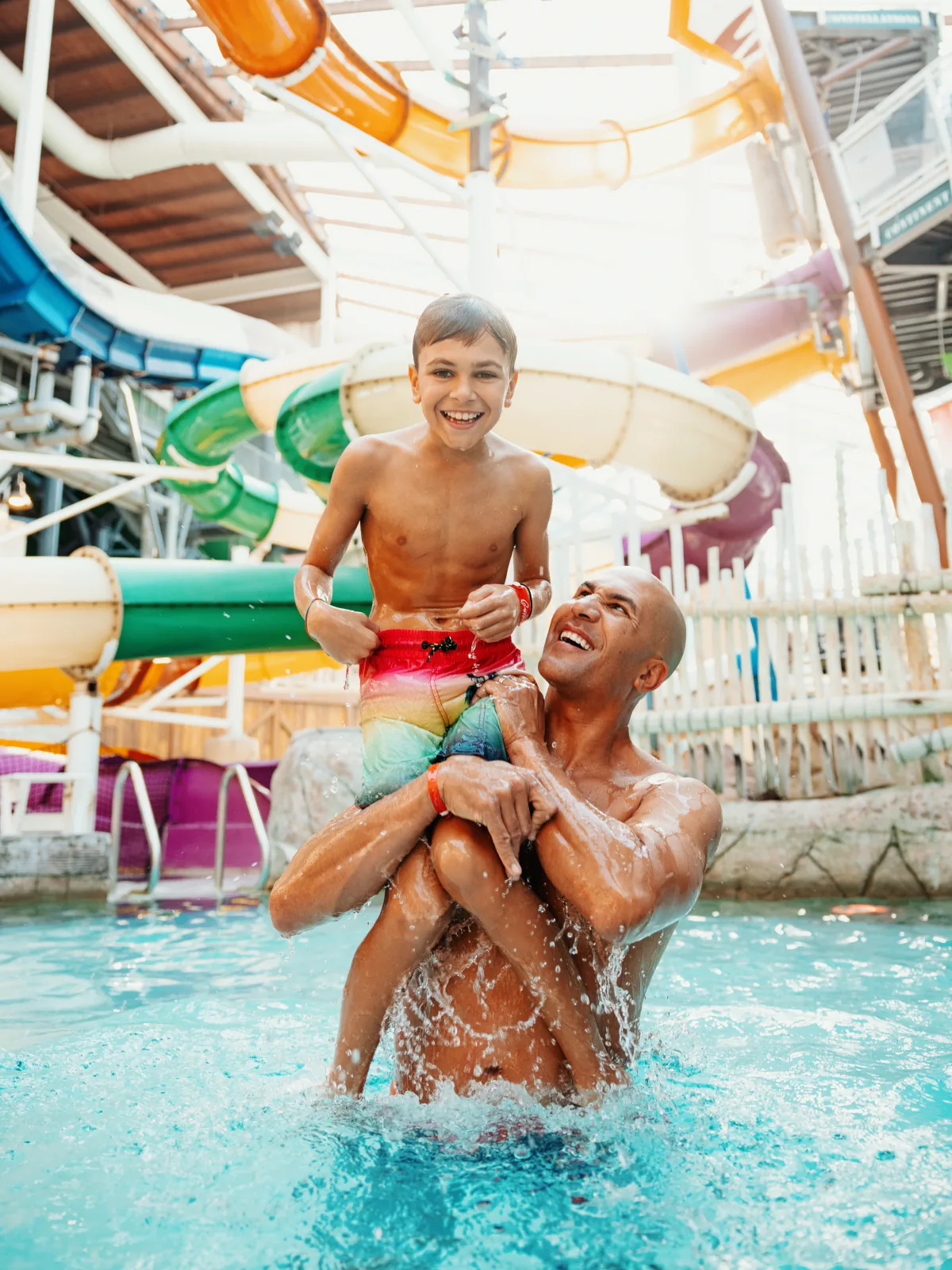 Aquatopia indoor waterpark — vertical key art still from the campaign.