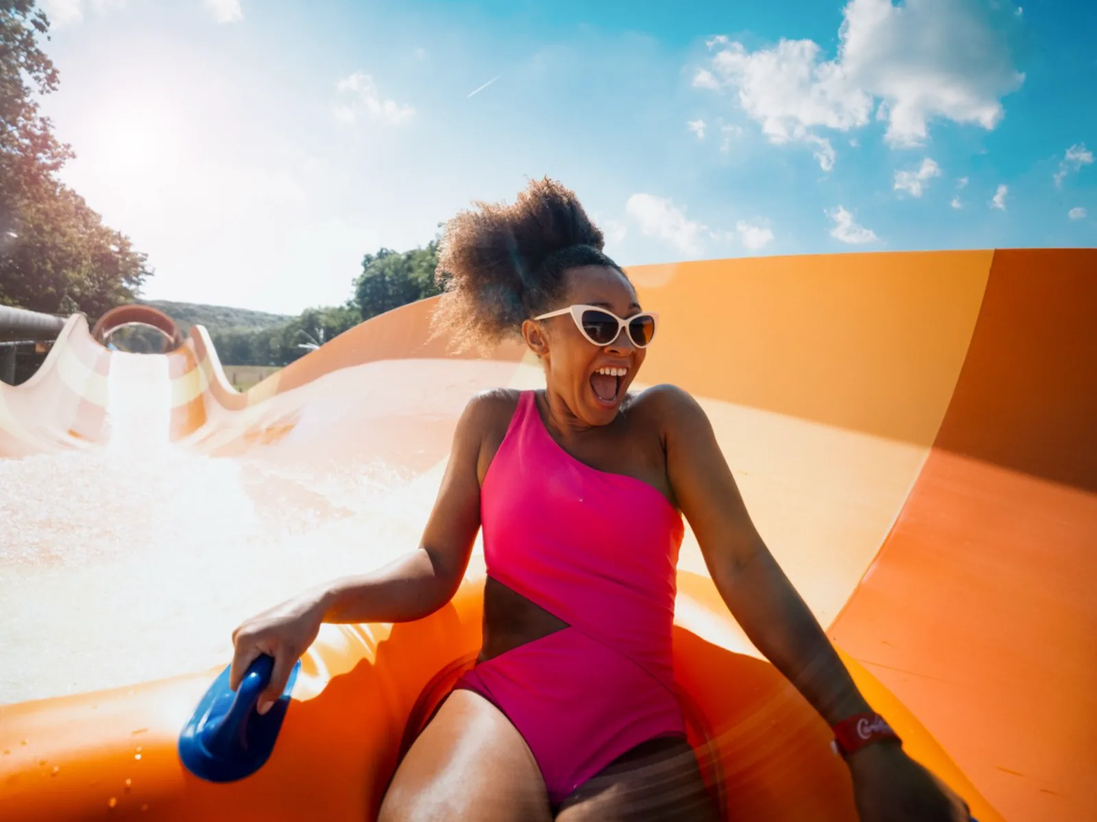 Camelback summer campaign — sunlit lakeside scene from the 2025 brand work.