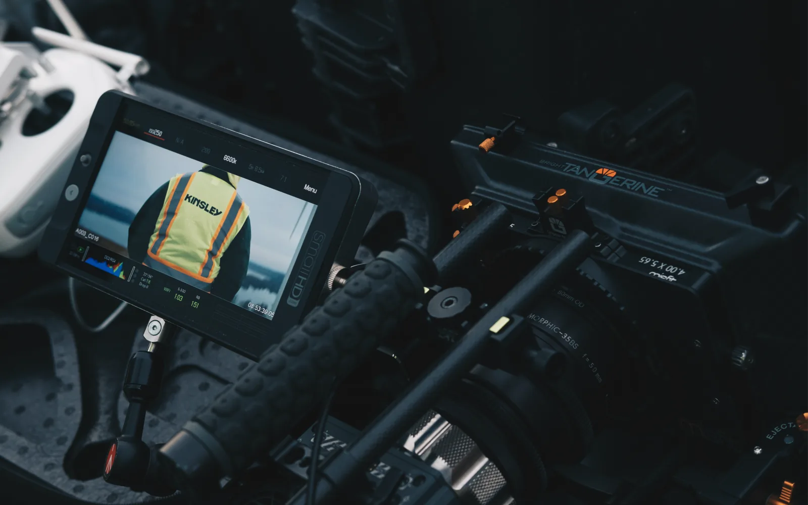 Two Kinsley Construction workers in hi-vis vests looking out at the downtown skyline they're helping build.